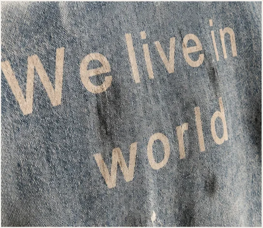 Detail of graphic placement on faded vintage blue denim.